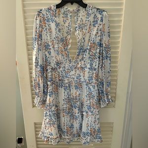 Open back mini dress with ruffles.